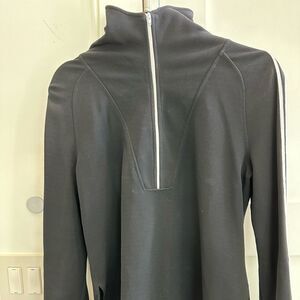 Ladies black 3/4 zip long sleeve top. White stripe. Size medium